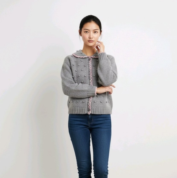 Sweaters - Gray knit  popcorn-stitch baby cardigan with a pink scalloped trim. 